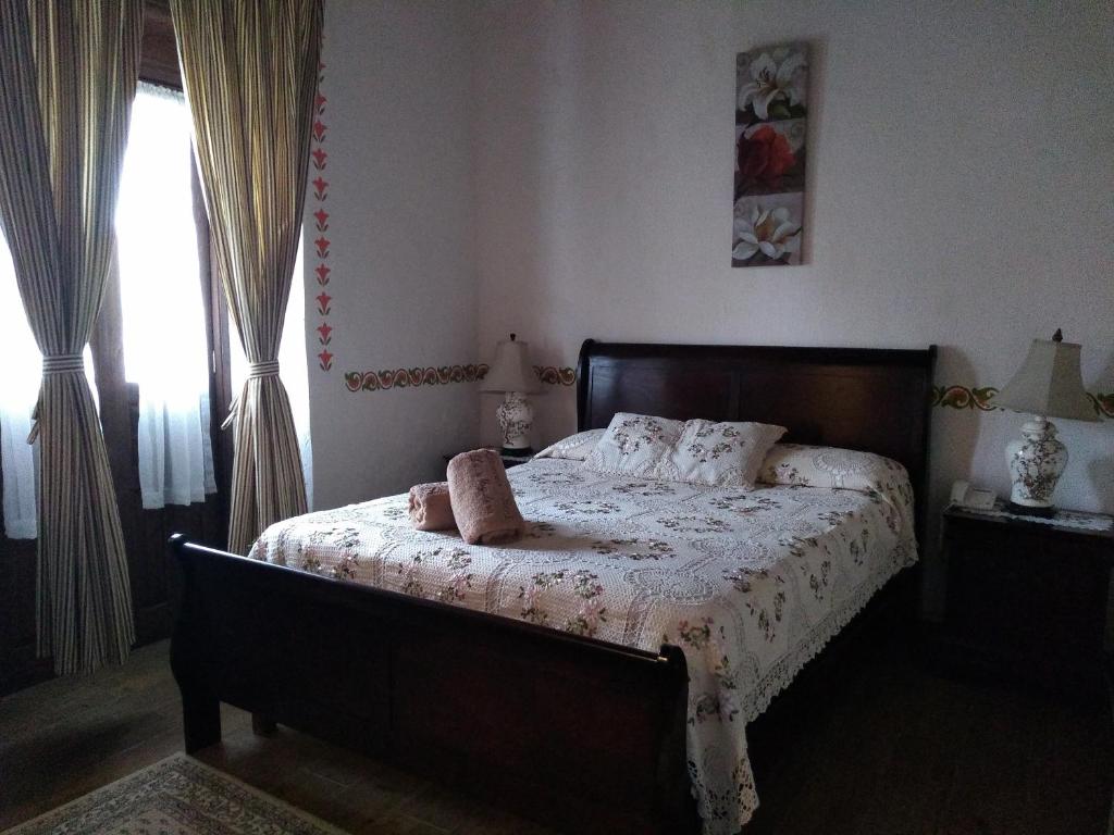 Postel nebo postele na pokoji v ubytování Hotel Spa Hacienda Real la Nogalera