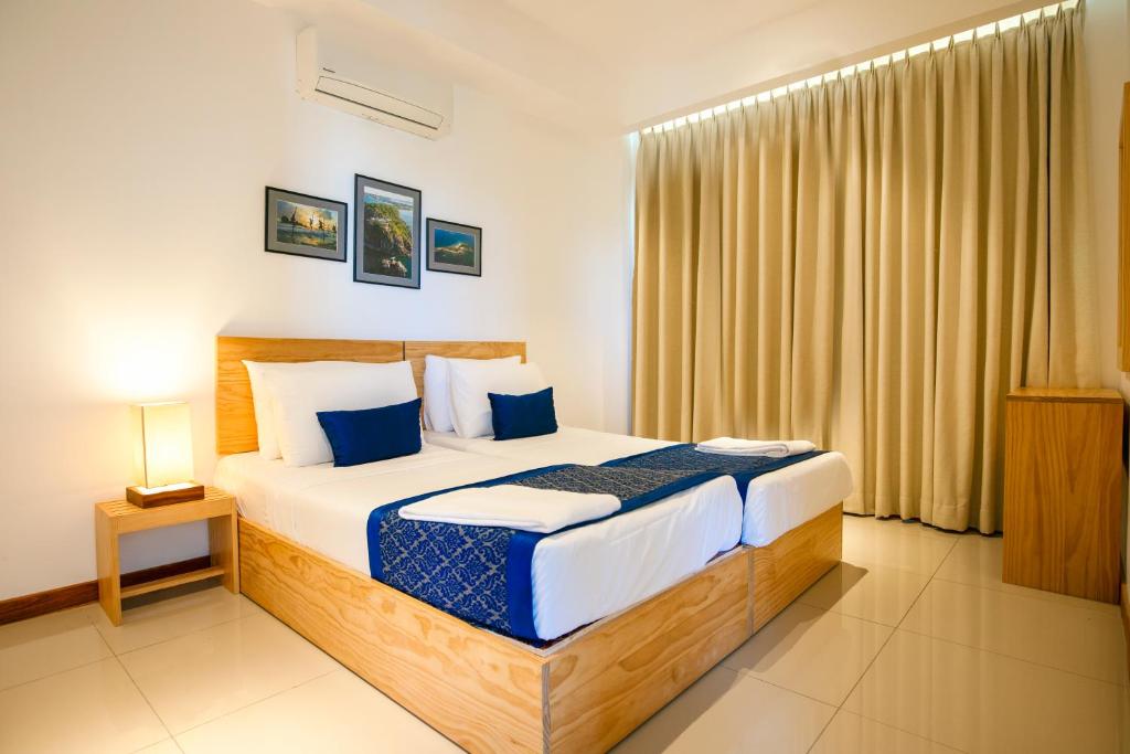Postel nebo postele na pokoji v ubytování Oceanfront Condominium - Nilaveli