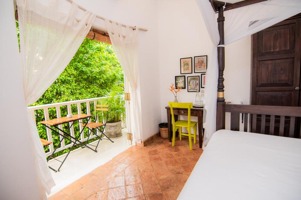 Postel nebo postele na pokoji v ubytování Mango House - Galle Fort