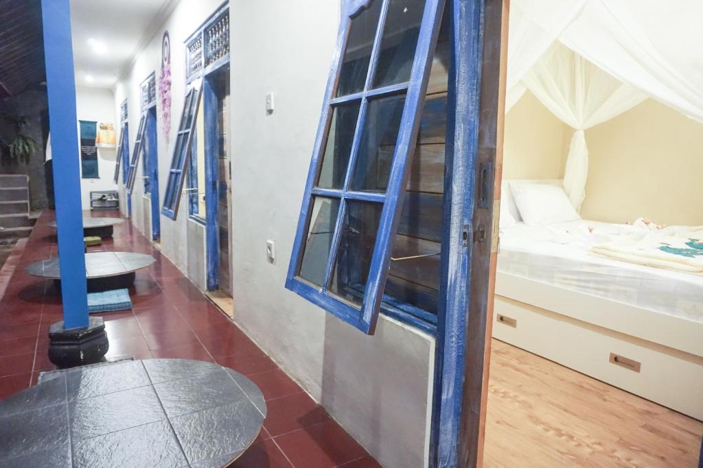 Postel nebo postele na pokoji v ubytování Damuh Guest House