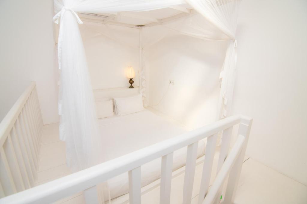 Postel nebo postele na pokoji v ubytování Mango House - Galle Fort