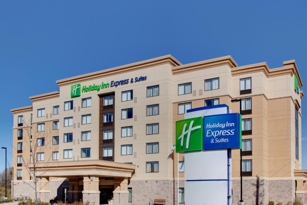 a hotel building with a sign in front of it at Holiday Inn Express & Suites Ottawa West - Nepean by IHG in Ottawa