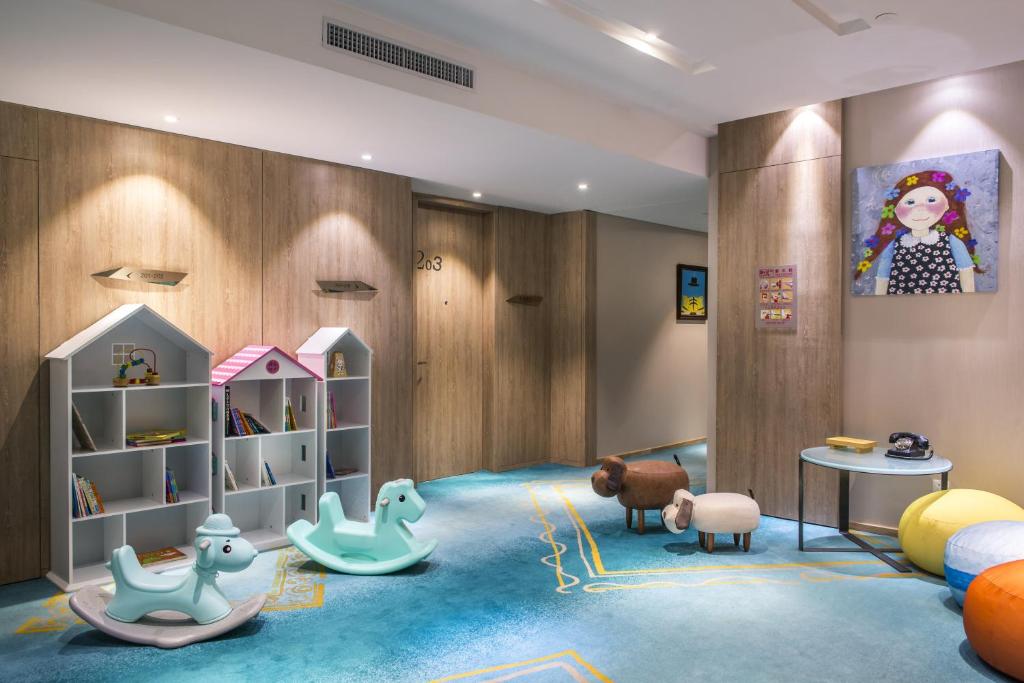 a childs room with a play area with toys at Hotel Indigo Xiamen Harbour, an IHG Hotel in Xiamen