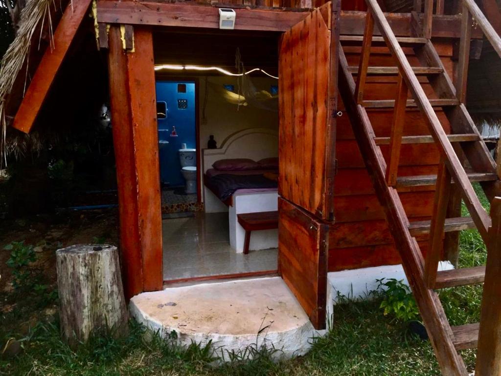 a room with a bunk bed and a ladder at Lazy Bones in Koh Rong Sanloem