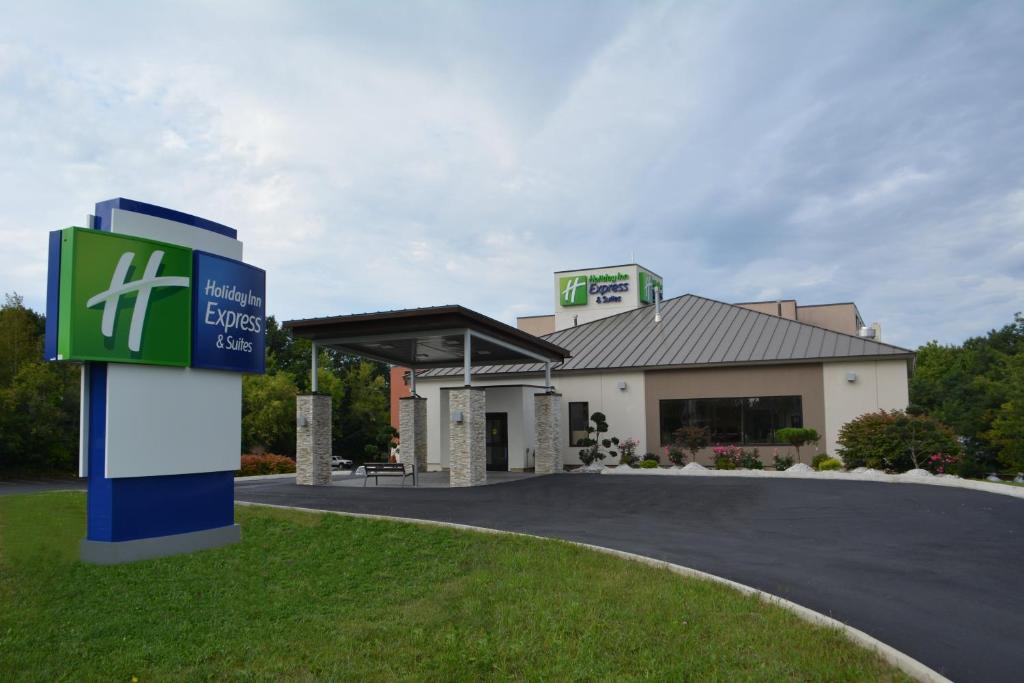 a large building with a sign on the side of it at Holiday Inn Express & Suites Waterville - North, an IHG Hotel in Waterville