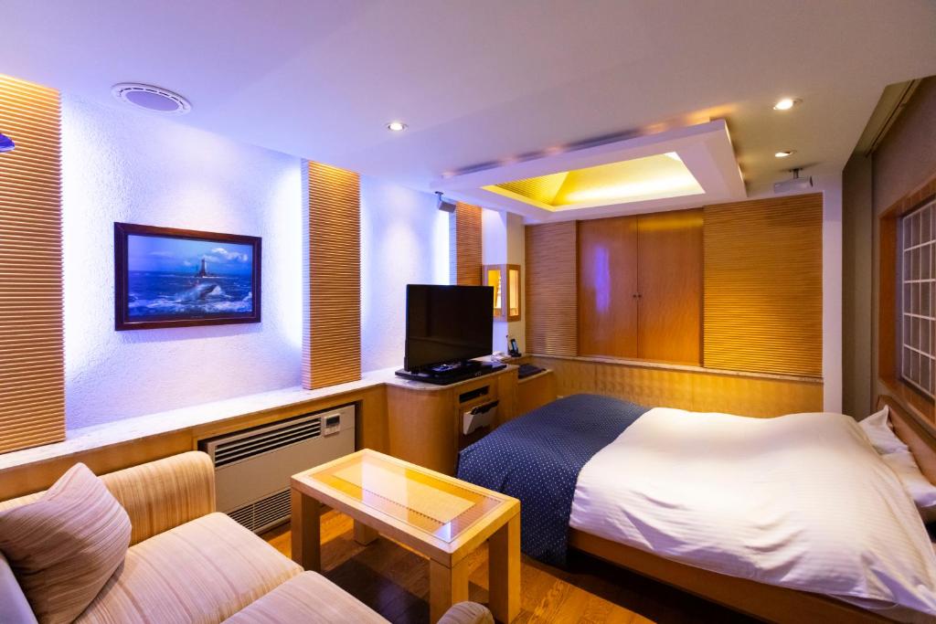 TV a/nebo společenská místnost v ubytování WATER HOTEL Cy (Audlt Only)