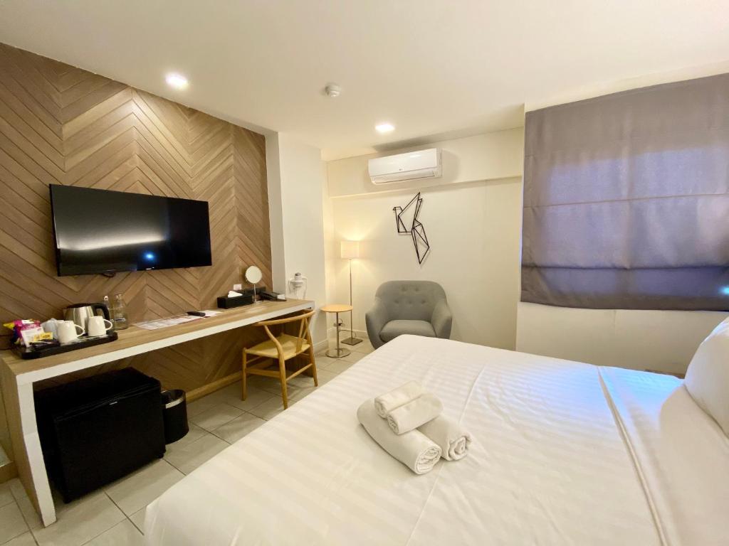 Postel nebo postele na pokoji v ubytování WE Terminal Hotel