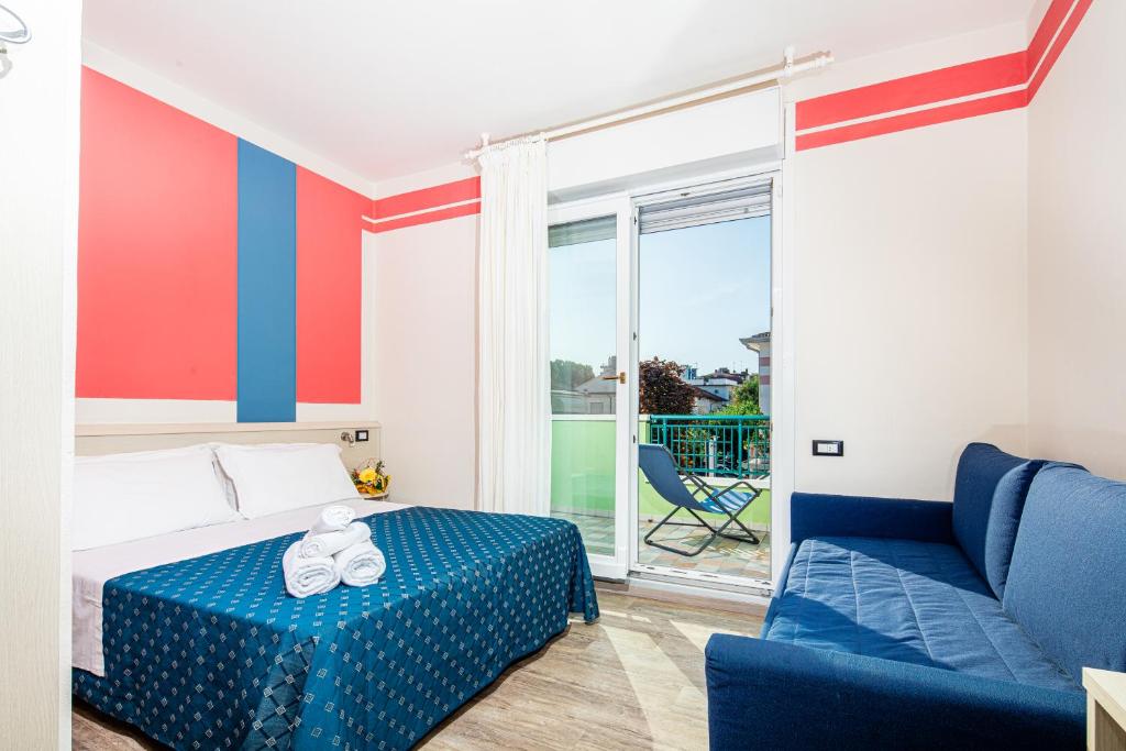 Postel nebo postele na pokoji v ubytování Hotel Orchidea