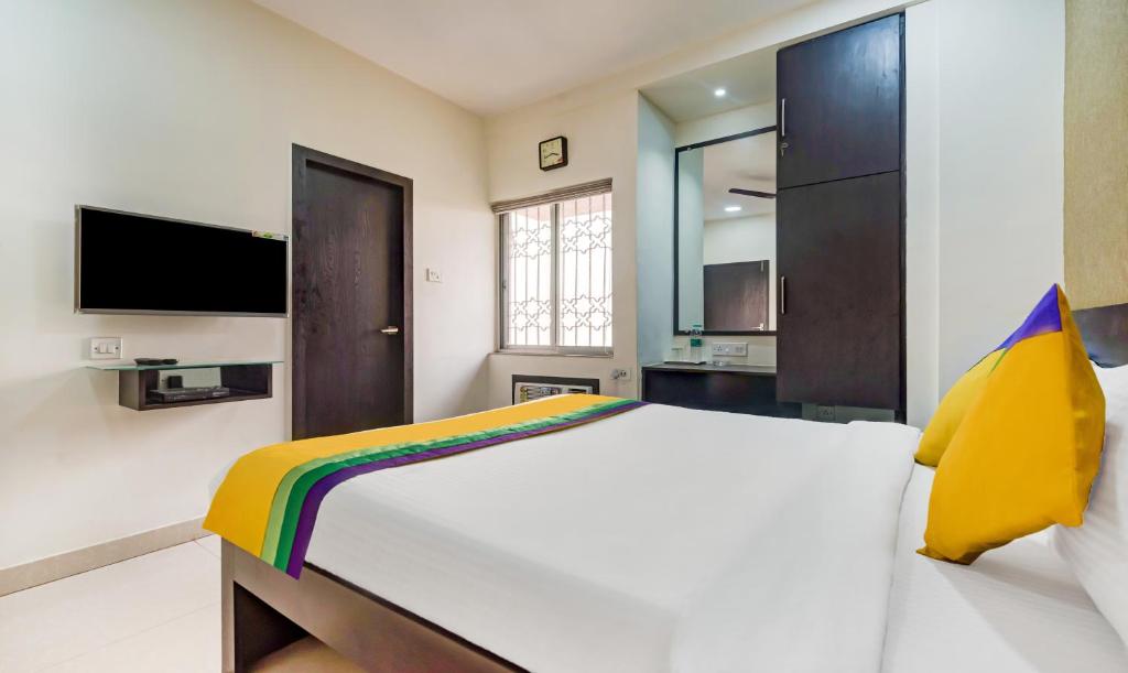 Postel nebo postele na pokoji v ubytování Itsy Hotels Neeranand Plaza