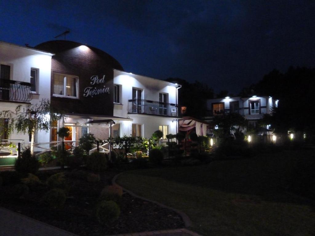 a night view of a building with lights at Rezydencja Pod Tężnią & SPA in Inowrocław