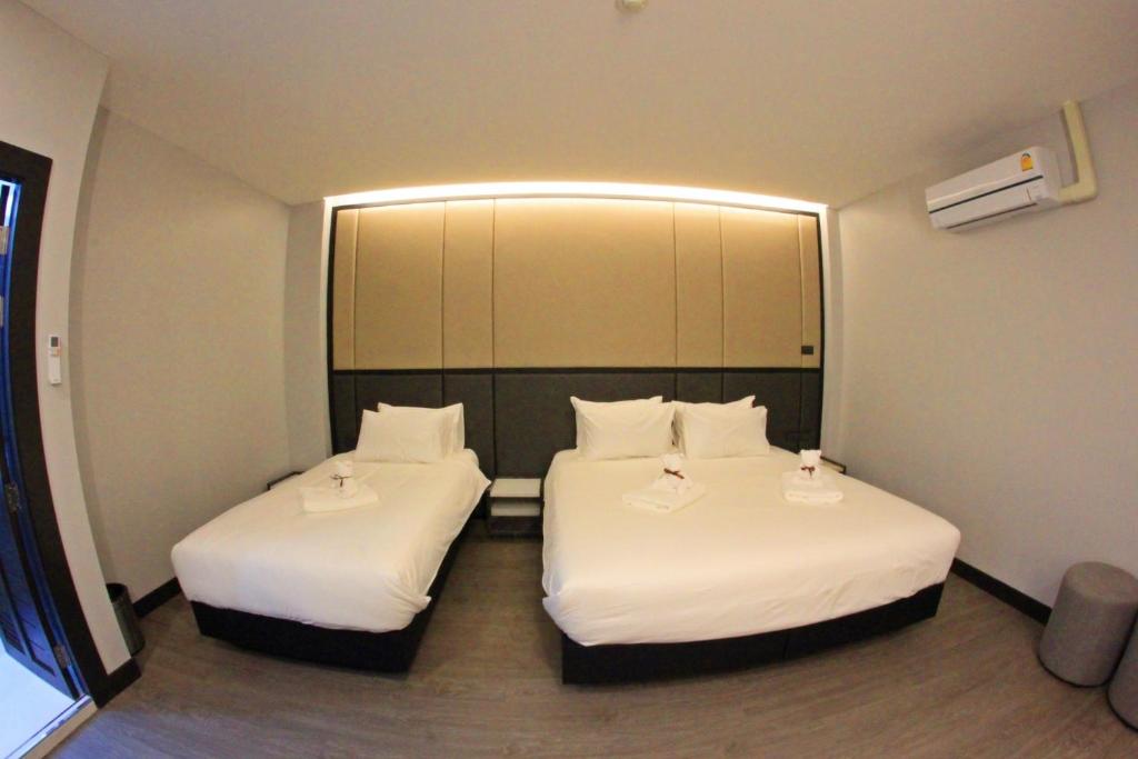 Postel nebo postele na pokoji v ubytování Orasa hotel