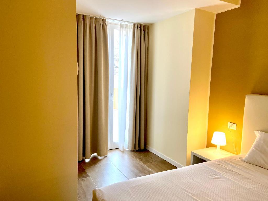 Postel nebo postele na pokoji v ubytování Verona Enjoy