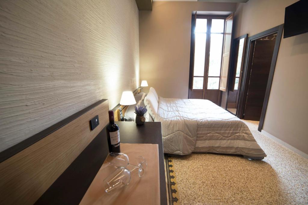 Letto o letti in una camera di Elda Hotel