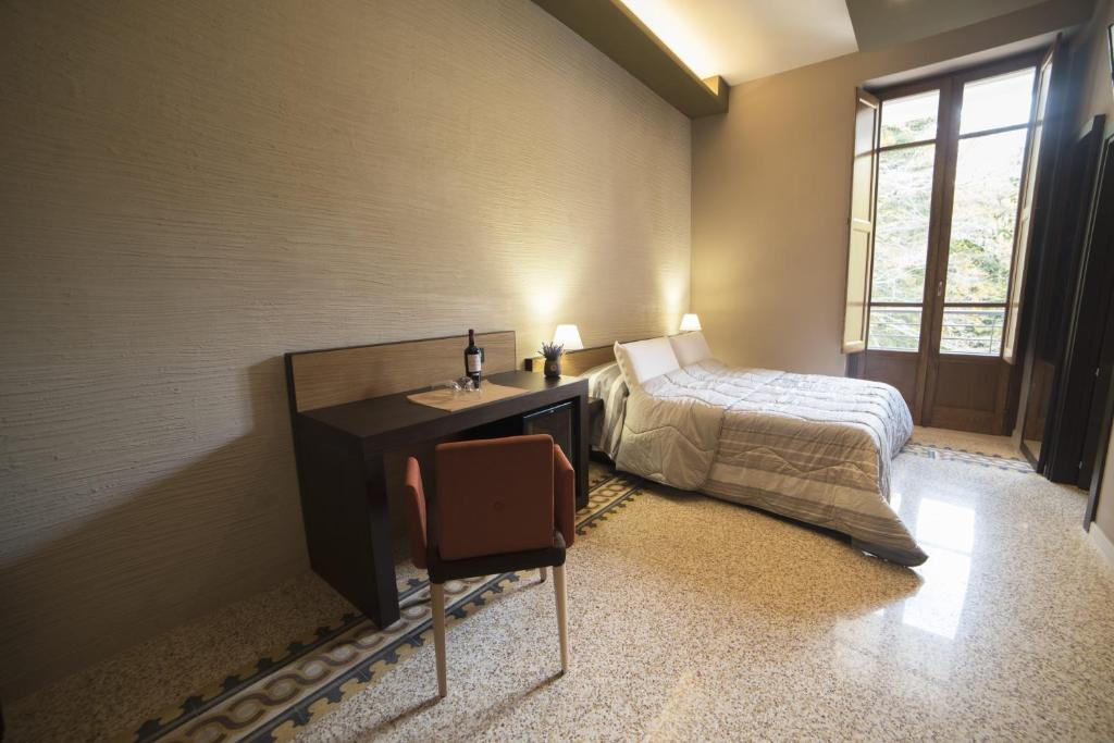 Letto o letti in una camera di Elda Hotel