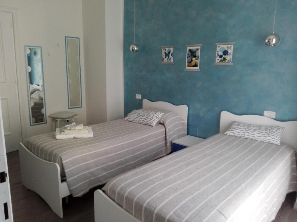 A bed or beds in a room at La Casa di Mà