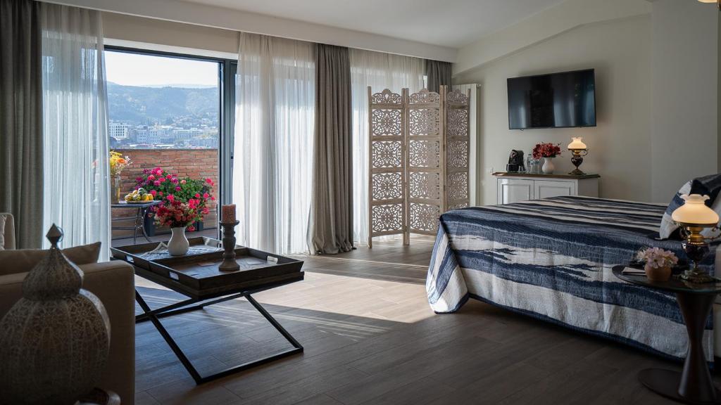 TV a/nebo společenská místnost v ubytování Hotel Passport Tbilisi