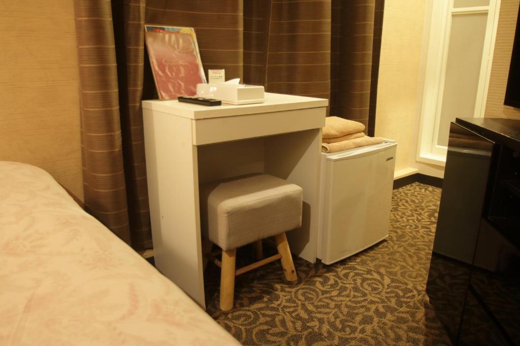 Postel nebo postele na pokoji v ubytování Tokyo Tourist Inn