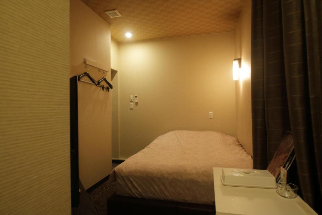Postel nebo postele na pokoji v ubytování Tokyo Tourist Inn