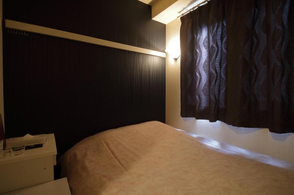 Postel nebo postele na pokoji v ubytování Tokyo Tourist Inn