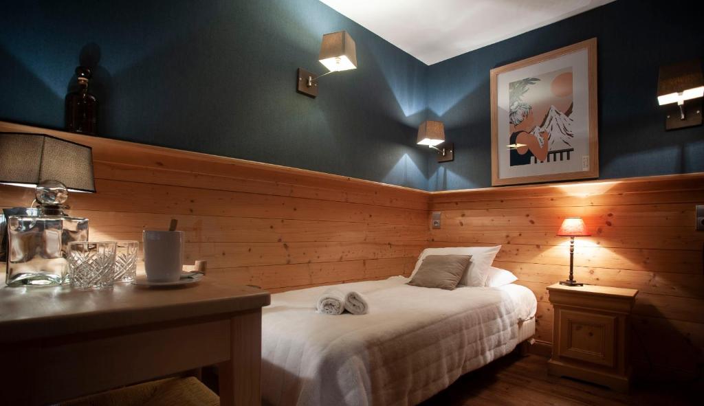 Postel nebo postele na pokoji v ubytování Hotel Le Monal