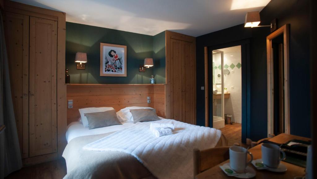 Postel nebo postele na pokoji v ubytování Hotel Le Monal