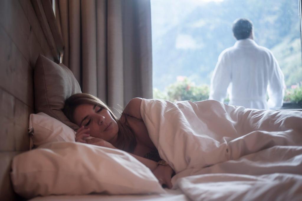 Postel nebo postele na pokoji v ubytování Hotel Le Monal