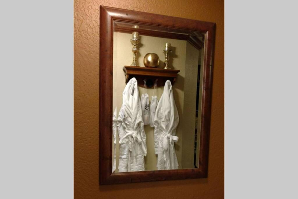 a mirror in a hotel room with white robes at 4.5 Star!~Come to Paradise~Utah Alps~back door ski in Park City