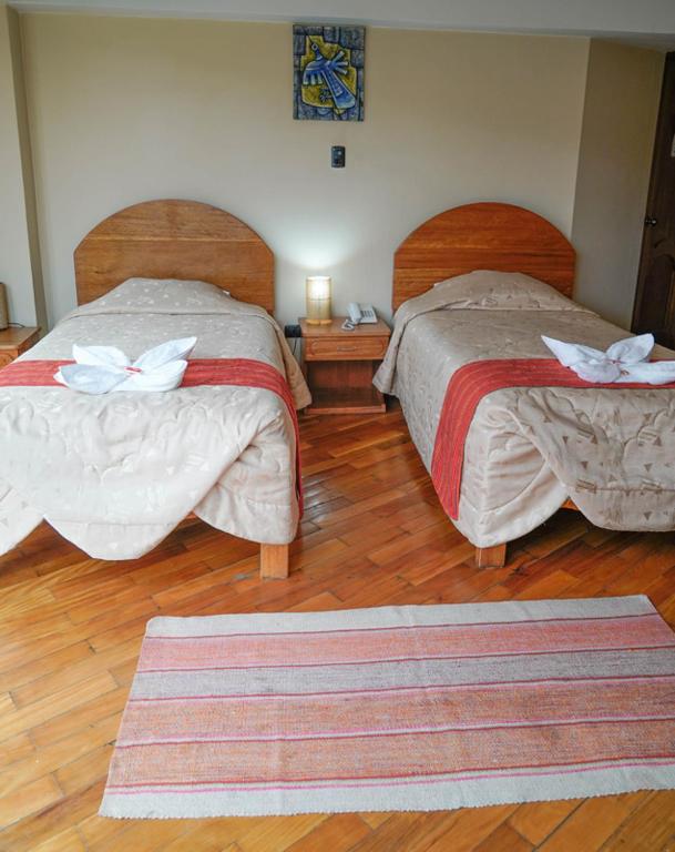 Postel nebo postele na pokoji v ubytování Hotel Melanys