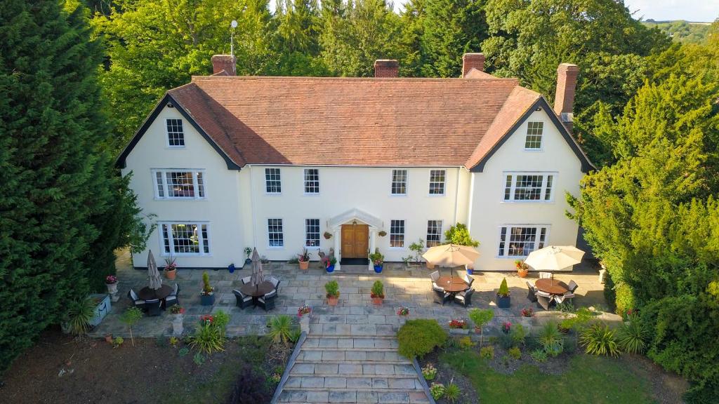 an aerial view of a large white house at Sturmer Hall Hotel and Conference Centre in Haverhill