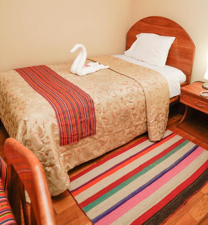Postel nebo postele na pokoji v ubytování Hotel Melanys