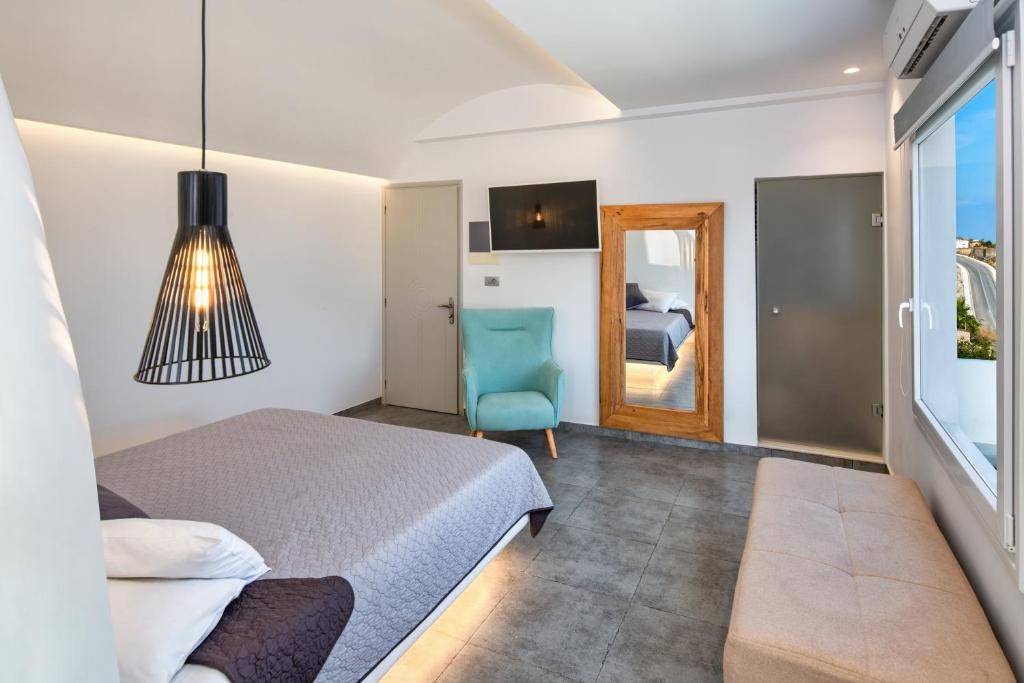 Postel nebo postele na pokoji v ubytování Gianna Suites
