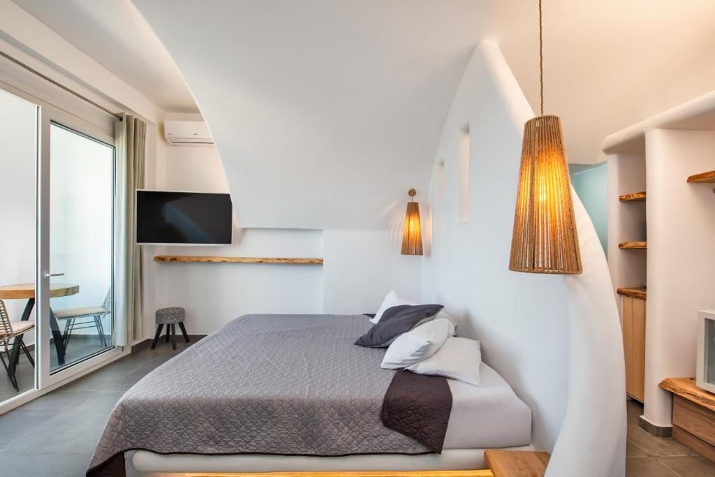 Postel nebo postele na pokoji v ubytování Gianna Suites