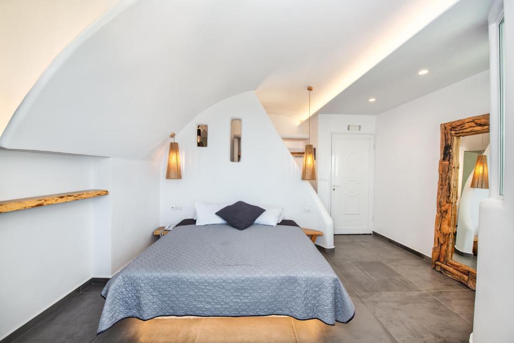 Postel nebo postele na pokoji v ubytování Gianna Suites