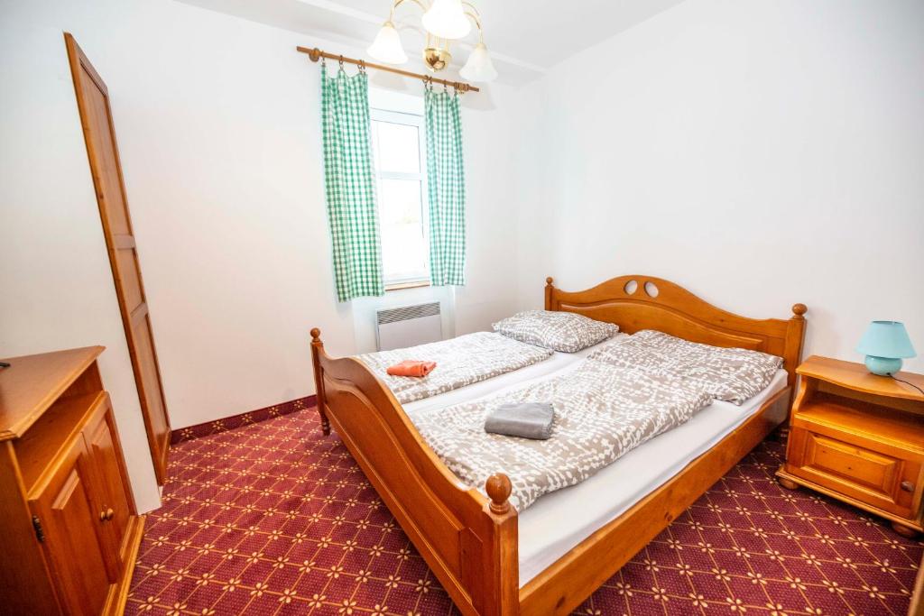 Postel nebo postele na pokoji v ubytování Hotel Svaty Hubert