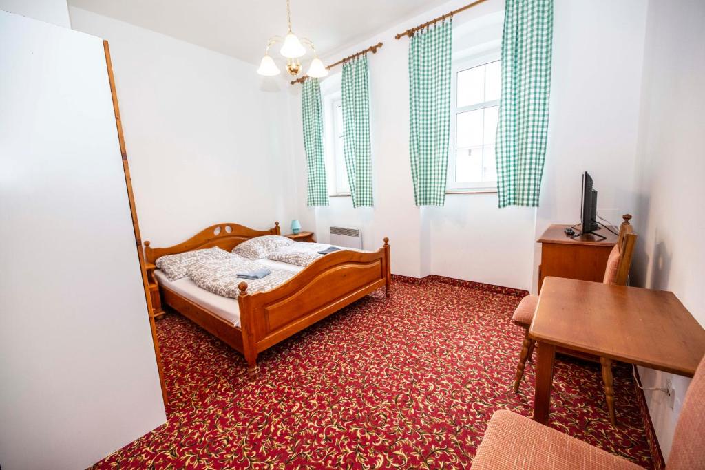 Postel nebo postele na pokoji v ubytování Hotel Svaty Hubert