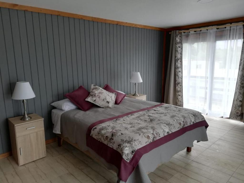 Vuode tai vuoteita majoituspaikassa Apart Hotel y Cabañas Valle Exploradores