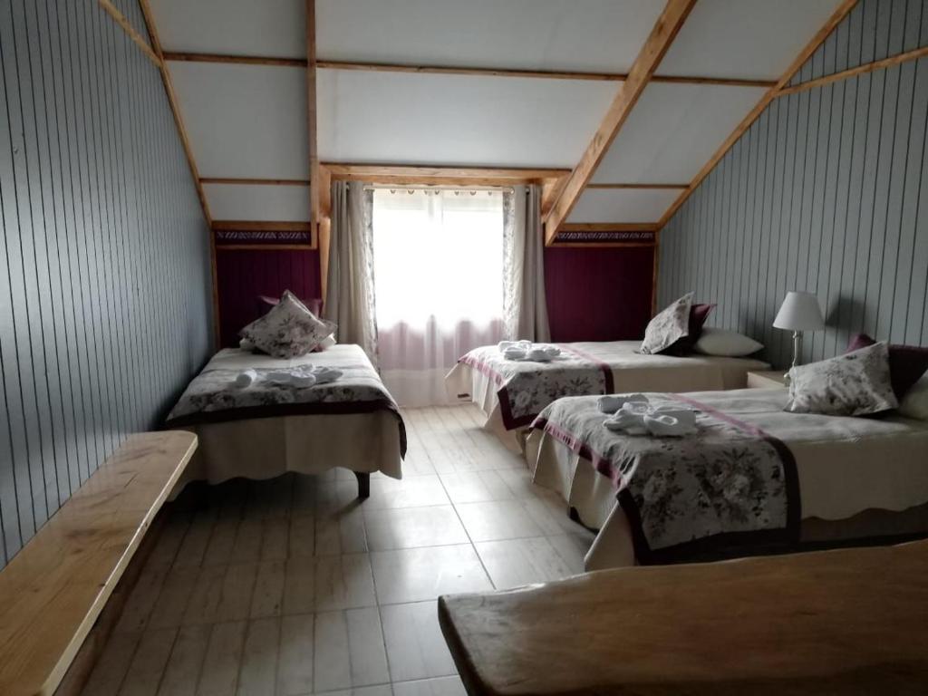 Vuode tai vuoteita majoituspaikassa Apart Hotel y Cabañas Valle Exploradores