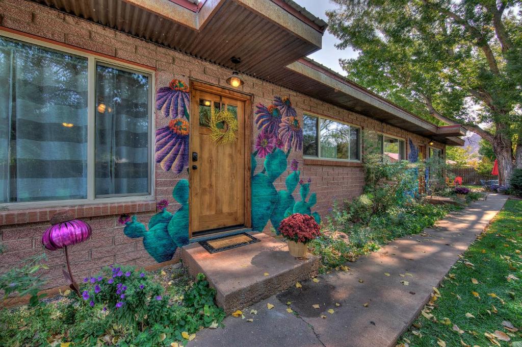 a house with a door painted on the side of it at Desert Gardens #1 in Moab