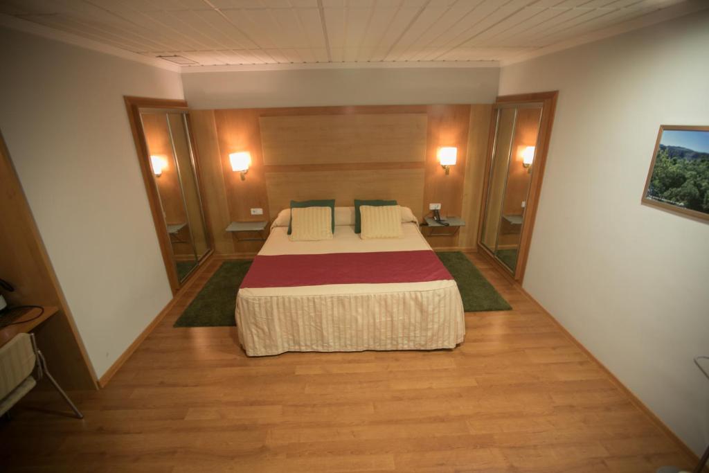 Postel nebo postele na pokoji v ubytování Hotel Reconquista