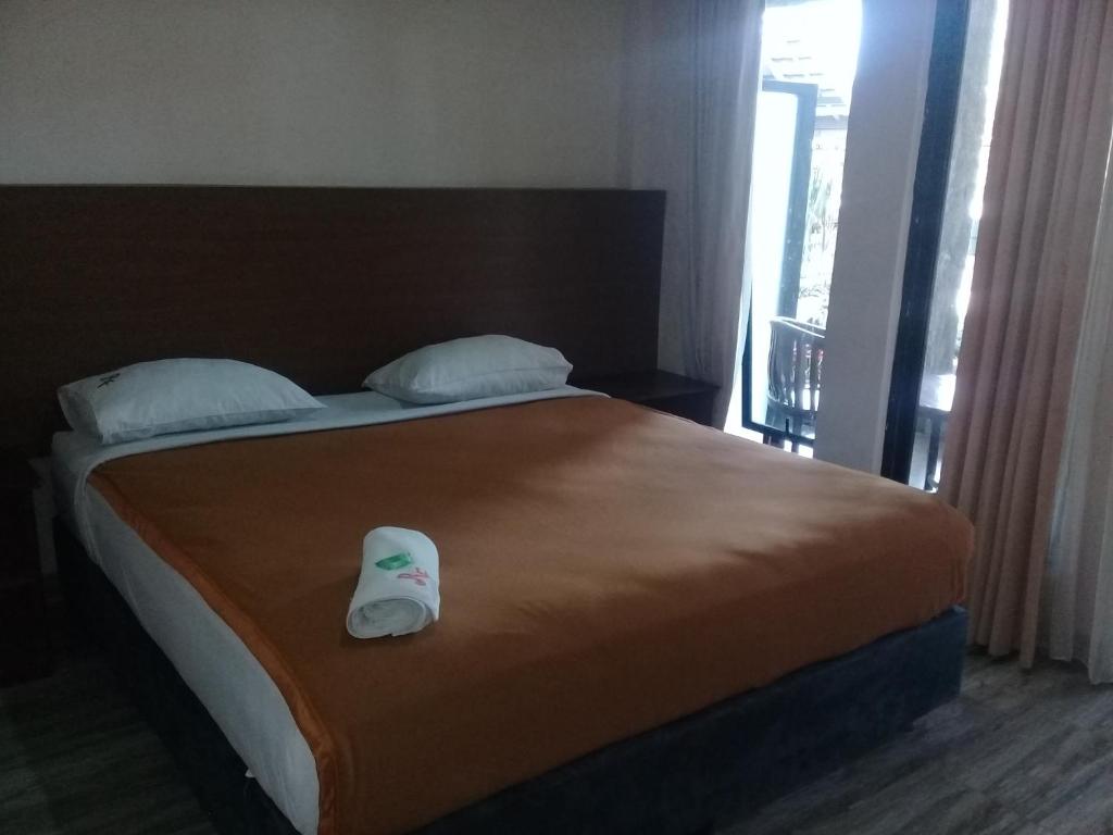 Postel nebo postele na pokoji v ubytování RF Hotel