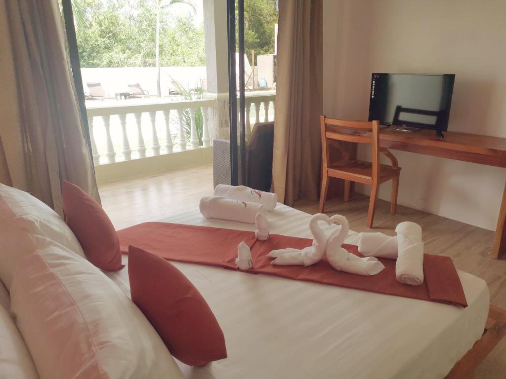 Postel nebo postele na pokoji v ubytování Portofino Panglao Bohol