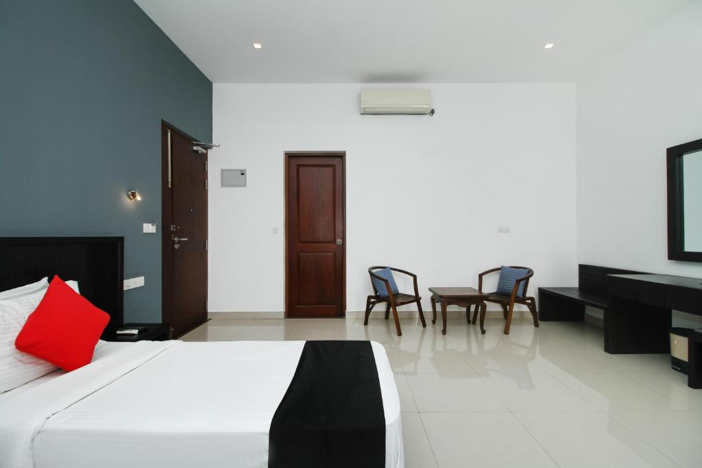 Postel nebo postele na pokoji v ubytování Golden Pier City Hotel