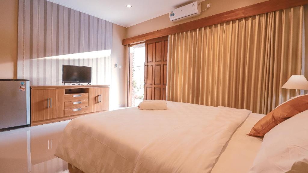 Postel nebo postele na pokoji v ubytování Mia Guest House