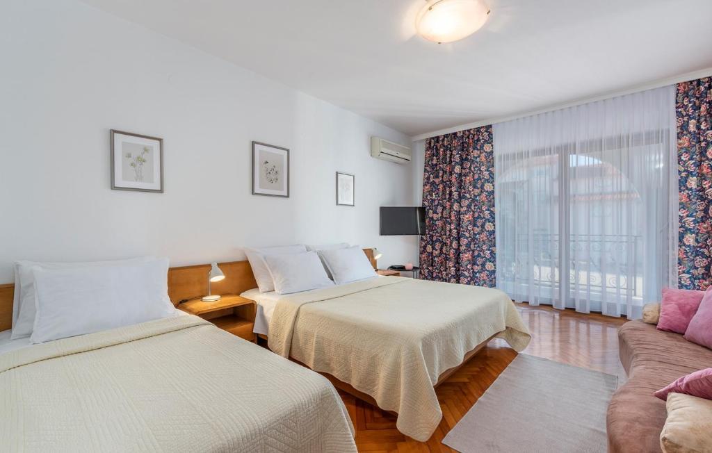 Postel nebo postele na pokoji v ubytování Apartment Complex Silvana