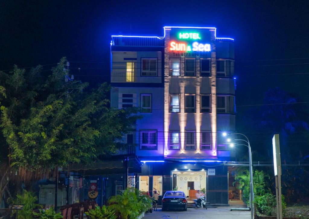 a building with a sign that reads hotel sun set at Sun & Sea Hotel in Phú Quốc