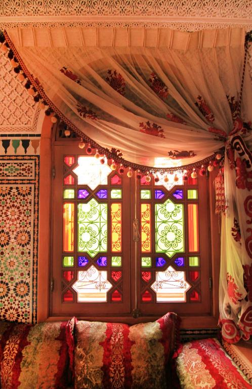 Postel nebo postele na pokoji v ubytování Riad Raouia HAMMAM & SPA