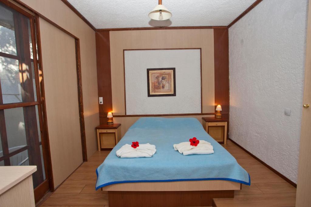 Postel nebo postele na pokoji v ubytování Damnoni Paradise