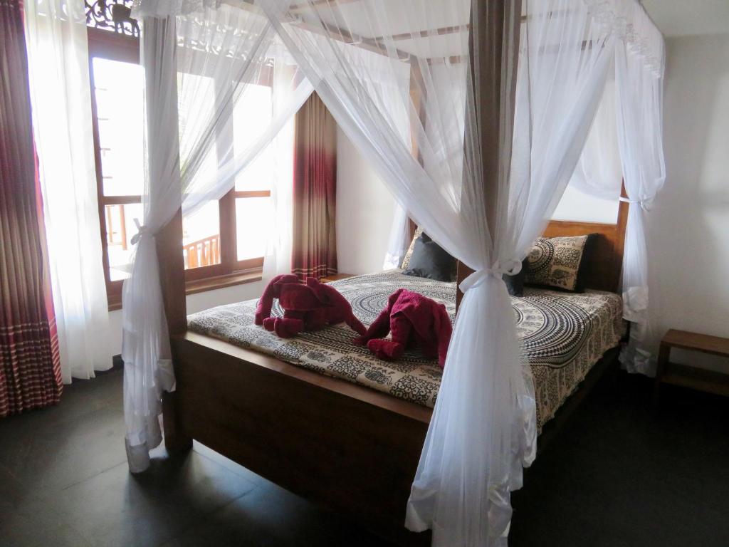 Postel nebo postele na pokoji v ubytování Thoduwawa Beach Villa