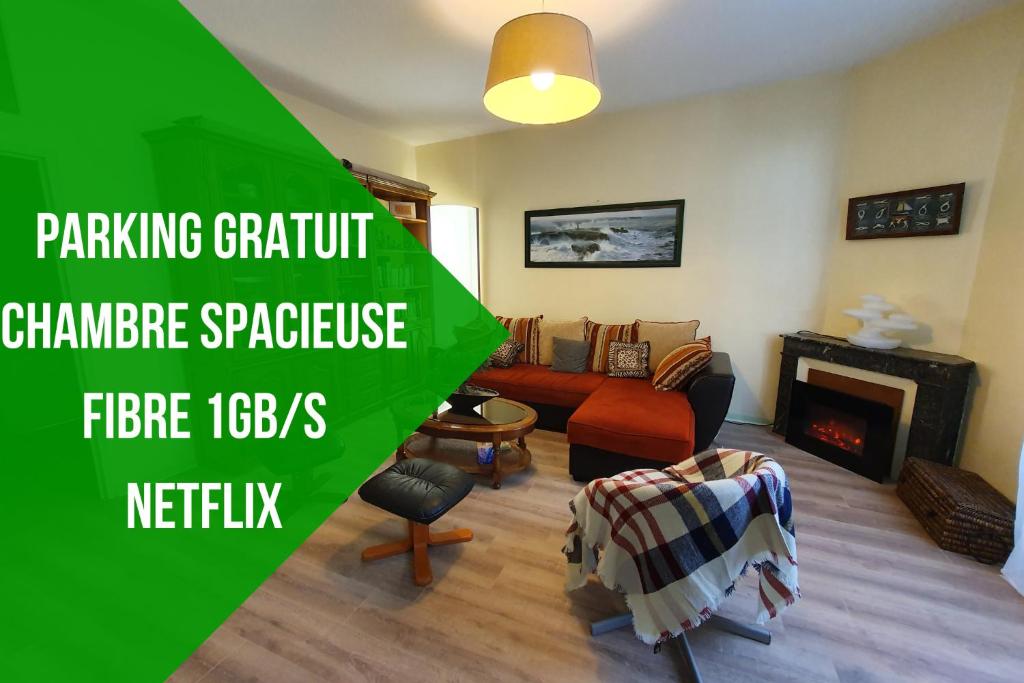 a living room with a couch and a fireplace at La tanière du Corsaire -16 Pers in Redon