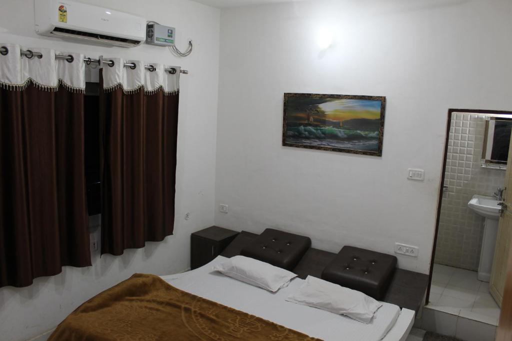 Postel nebo postele na pokoji v ubytování Hotel Sunset